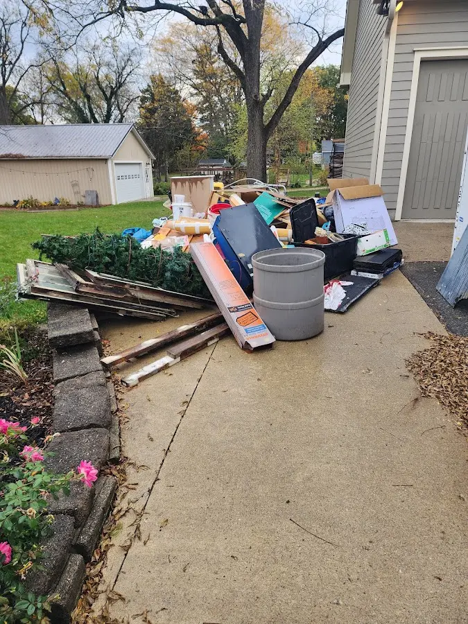Dumpster being loaded with debris for 30 Yard Dumpster Rental in Lincoln Park